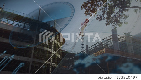 Showing concrete building rising at urban site with tower crane scaffolding and blueprint overlay Showing concrete building rising at urban site with tower crane scaffolding and blueprint overlay 133510497