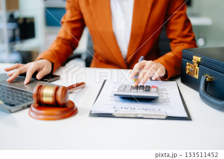 justice and law concept.Female judge in a courtroom on table and Counselor or Male lawyer working justice and law concept.Female judge in a courtroom on table and Counselor or Male lawyer working 133511452
