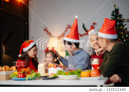 Joyful Asian family celebrating Christmas together with gifts, festive food, and decorations, capturing love, Joyful Asian family celebrating Christmas together with gifts, festive food, and decorations, capturing love, 133512340