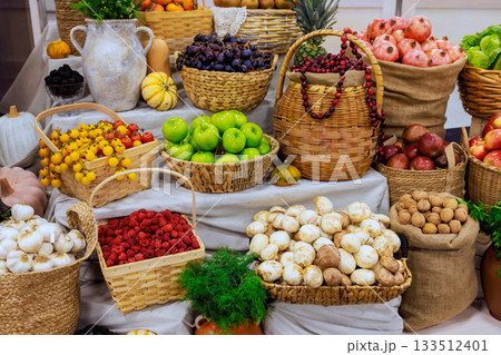 Various fruits vegetables are arranged in baskets, of autumn harvest season at local market Various fruits vegetables are arranged in baskets, of autumn harvest season at local market 133512401