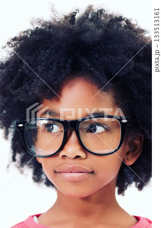 Close up of thoughtful girl with frizzy hair wearing big glasses 133513161