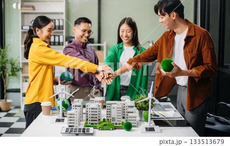 Sustainable innovation by young professionals for a greener future. Showcasing renewable energy solutions with solar panels, wind 133513679