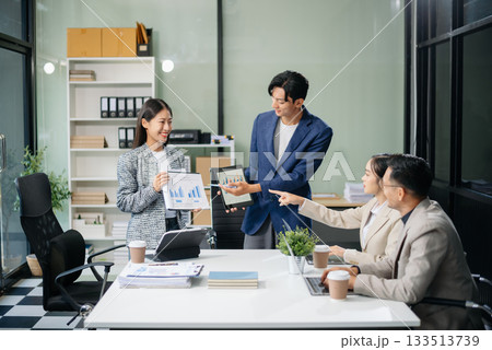 Business teamwork and collaboration among Asian professionals in a modern office 133513739