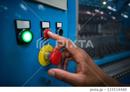 Hand pressing a red button 133514480