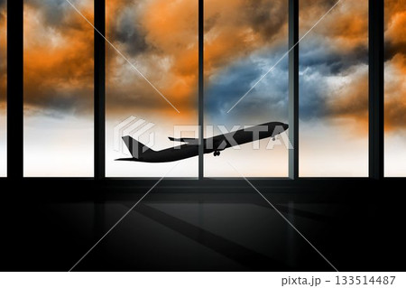 Airplane flying past window in orange sky Airplane flying past window in orange sky 133514487