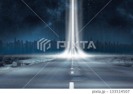 Road leading out to the horizon with light beam 133514507