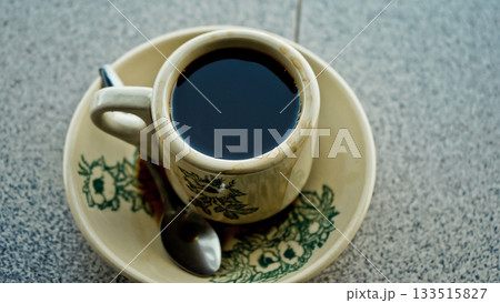 Close-up photo of a cup of black coffee Close-up photo of a cup of black coffee 133515827