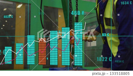 Factory worker operating pendant control at workshop, with digital charts, £€¥ symbols, copy space 133518805
