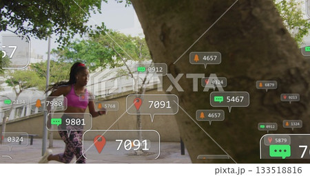 Jogging Black runner in sportswear on city path, holding phone showing AR data, copy space Jogging Black runner in sportswear on city path, holding phone showing AR data, copy space 133518816
