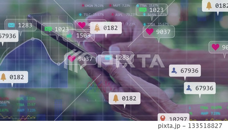 Mature adult hands holding smartphone on digital analytics interface, with overlay notifications Mature adult hands holding smartphone on digital analytics interface, with overlay notifications 133518827