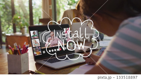 Writing Chinese girl in striped shirt taking notes at home with laptop, pencil holder, copy space Writing Chinese girl in striped shirt taking notes at home with laptop, pencil holder, copy space 133518897