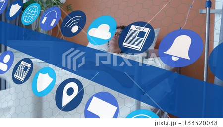 Lying patient on bed in patient care room, with floating technology icons and IV pole 133520038