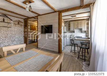 Cozy Rustic Apartment Interior with Kitchen and Dining Area Cozy Rustic Apartment Interior with Kitchen and Dining Area 133522373