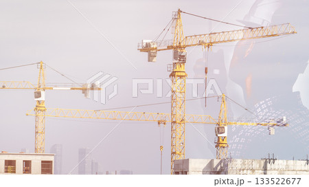 An engineering worker working in industry, the concept of teamwork in a city with a double exposure, the possibility of radio communication, a contractor technician, an architect, a blue banner on the An engineering worker working in industry, the concept of teamwork in a city with a double exposure, the possibility of radio communication, a contractor technician, an architect, a blue banner on the 133522677