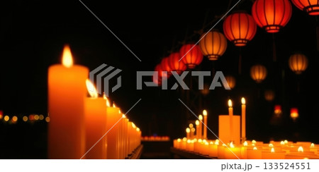 Glowing candles and vibrant red lanterns create a warm, festive ambiance 133524551
