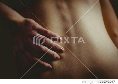 bare torso is showing in low-key 3D render, with hand resting on lower back featuring ring bare torso is showing in low-key 3D render, with hand resting on lower back featuring ring 133525347