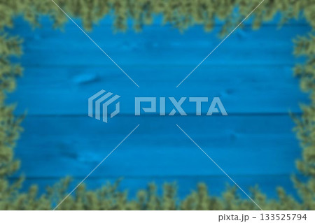 Blurred fir tree branches on wood 133525794