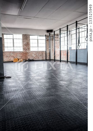 Vector flat design showing empty CrossFit gym with rubber flooring, pull up rig, rings, kettlebells Vector flat design showing empty CrossFit gym with rubber flooring, pull up rig, rings, kettlebells 133525949