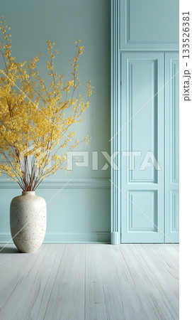 Minimalist Interior with Yellow Forsythia in Vase Against Blue Wall 133526381