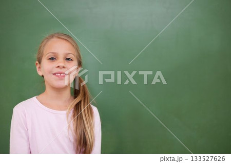 Flat design child is standing wearing pink shirt in front of green chalkboard, copy space 133527626
