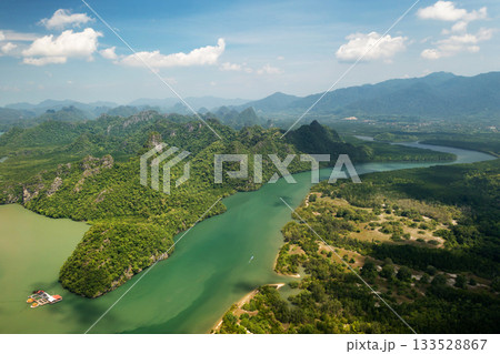 Top view of the beautiful mountains and river in KILIM Geopark on a sunny day with a clear sky. Langkawi. Malaysia Top view of the beautiful mountains and river in KILIM Geopark on a sunny day with a clear sky. Langkawi. Malaysia 133528867