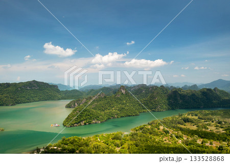 Aerial view of the River and green hills in KILIM Geopark on a sunny day with a clear sky. Langkawi. Malaysia Aerial view of the River and green hills in KILIM Geopark on a sunny day with a clear sky. Langkawi. Malaysia 133528868