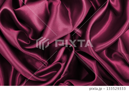 Smooth elegant pink silk or satin luxury cloth texture as abstract background. Luxurious background design 133529333