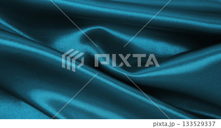 Smooth elegant blue silk or satin luxury texture as abstract background. Luxurious Christmas background or New Year background design 133529337