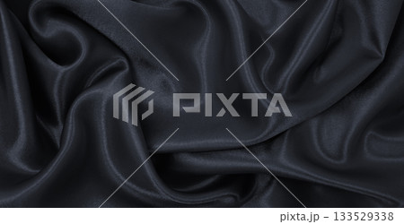 Smooth elegant dark grey silk or satin luxury cloth texture as abstract background. Luxurious background design 133529338