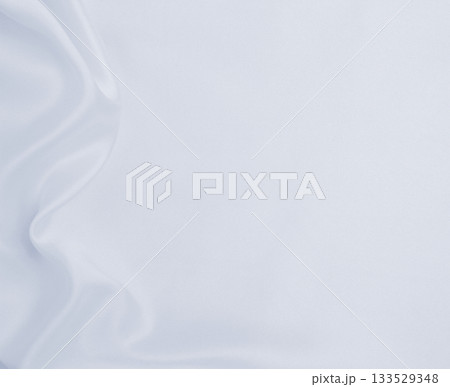 Smooth elegant grey silk or satin luxury cloth as wedding background. Luxurious background design Smooth elegant grey silk or satin luxury cloth as wedding background. Luxurious background design 133529348