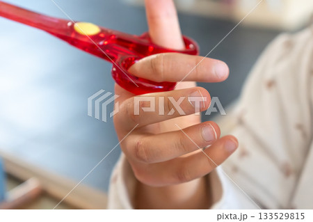 Child having fun with an authentic leisure activity, fine motor skills development Child having fun with an authentic leisure activity, fine motor skills development 133529815