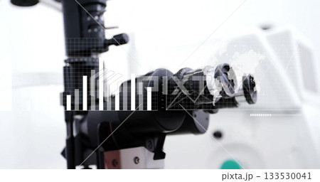 Showcasing microscope turret on laboratory bench with adjustment knobs, graphical overlays 133530041