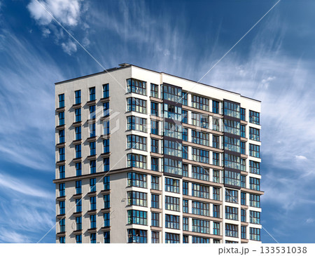 Urban architecture shows luxurious highrise building. Tall modern apartment tower with balconies and Urban architecture shows luxurious highrise building. Tall modern apartment tower with balconies and 133531038