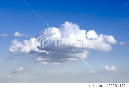 Cloud in blue sky with fluffy shape. White airy formation with soft bright light and natural horizon Cloud in blue sky with fluffy shape. White airy formation with soft bright light and natural horizon 133531181
