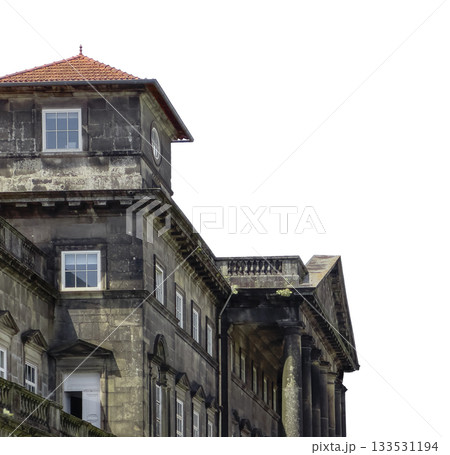 historic stone facade with columns and tiled roof. Classical architecture in European city with 133531194