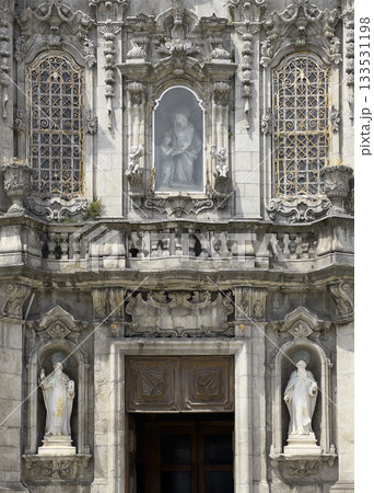 Igreja do Carmo church entrance in Porto Portugal with ornate statues and baroque details. Religious Igreja do Carmo church entrance in Porto Portugal with ornate statues and baroque details. Religious 133531198