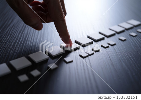 hand playing on a chess board hand playing on a chess board 133532151