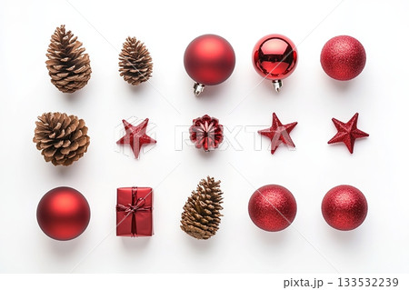 Christmas red baubles, pinecones, stars and present on white 133532239