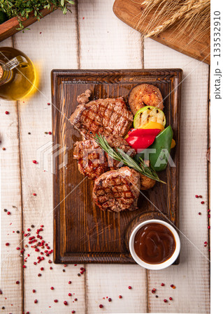 Grilled beef steak portion with vegetables Grilled beef steak portion with vegetables 133532910