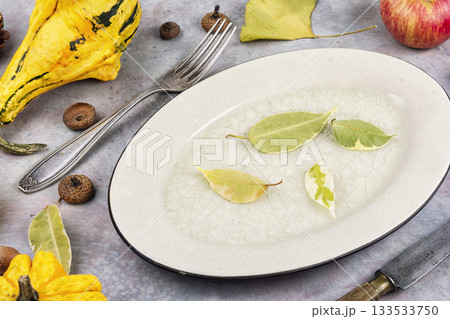 Apples and pumpkins with autumn leaves. 133533750