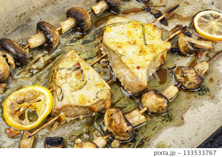 Tuna fish roasted with mushrooms on skewers. 133533767