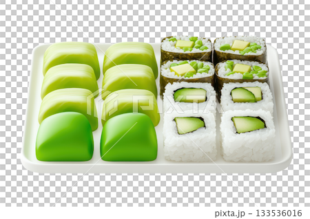 A vibrant assortment of sushi and mochi featuring green hues, beautifully arranged on a white tray. 133536016