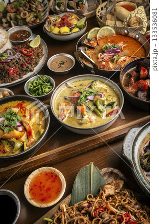 many different thai food dishes on table in modern restaurant in bangkok thailand 133536081