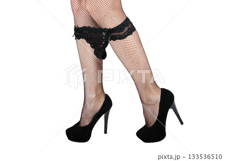 A woman takes off her underwear in stockings heels 133536510