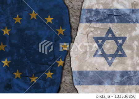 Symbolic split between European Union and Israel flags on cracked stone wall texture 133536856