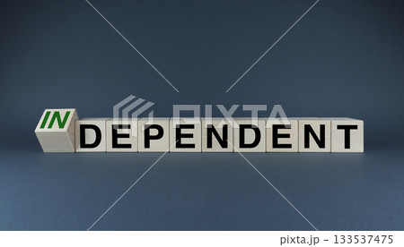Cubes form the words Independent or dependent. The concept of independence in business, international relations and personal life Cubes form the words Independent or dependent. The concept of independence in business, international relations and personal life 133537475
