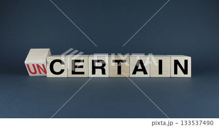 Cubes form the words Uncertain or Certain. Concept in business and lifestyle in decision making 133537490
