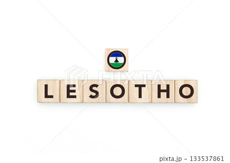 Wooden blocks bearing the name and flag of Lesotho. Basotho and South African Culture, national identity, travel, and geography in a copy space design. Wooden blocks bearing the name and flag of Lesotho. Basotho and South African Culture, national identity, travel, and geography in a copy space design. 133537861