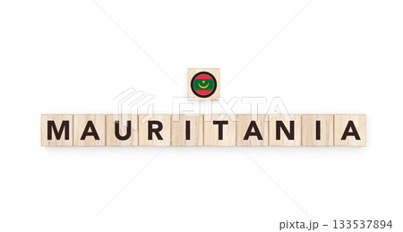 Wooden blocks bearing the name and flag of Mauritania. Mauritanian and African and Arab Culture, national identity, travel, and geography in a copy space design. 133537894