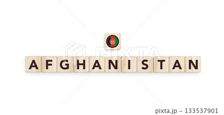 Wooden blocks bearing the name and flag of Afghanistan. Afghan, Arab and Asian Culture, national identity, travel, and geography in a copy space design. Wooden blocks bearing the name and flag of Afghanistan. Afghan, Arab and Asian Culture, national identity, travel, and geography in a copy space design. 133537901